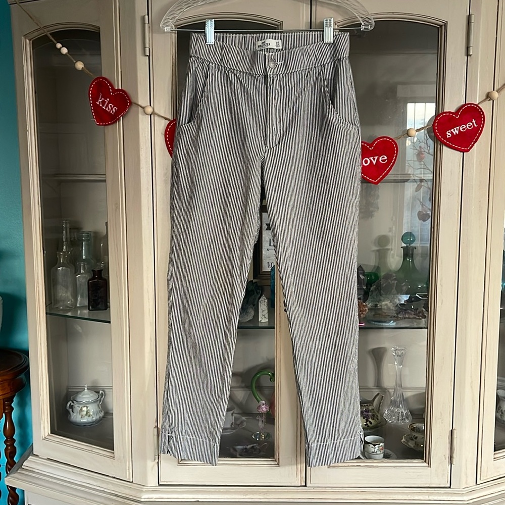 Hollister pants size extra small pixie pants with slit, black and white striped.